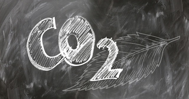 chemical formula of Carbon Dioxide - CO2 written on a black board.